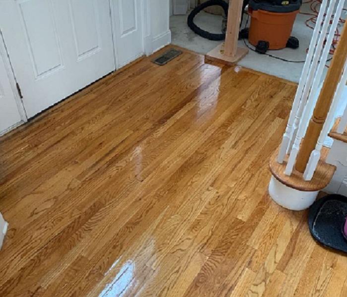Clean and shiny hardwood floor of a foyer