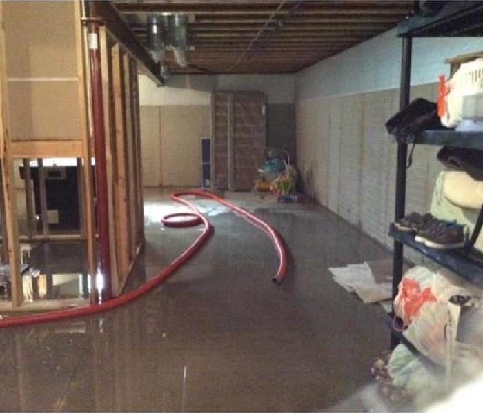 A basement full of contents and flooded with water