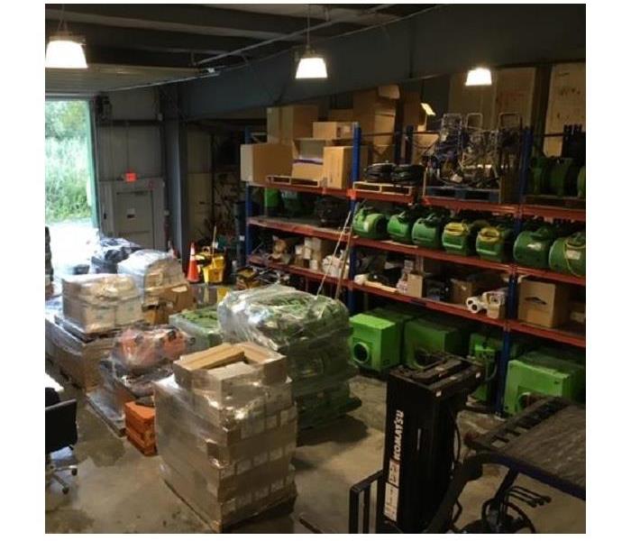 A warehouse with restoration equipment packed up and ready to go